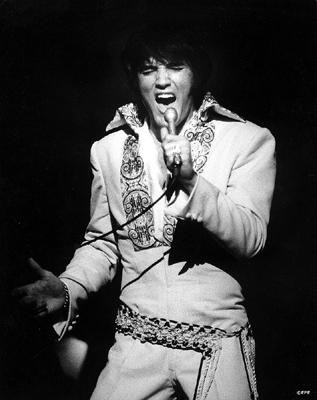 Elvis in white outfit_singing
