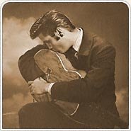 Elvis kissing his guitar
