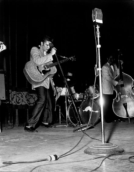 Elvis Presley dancing and singing
