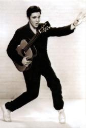 Elvis Presley dancing with a big smile
