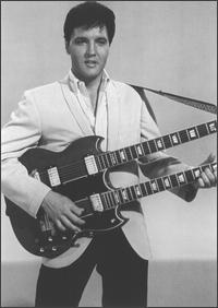Elvis Presley holding guitar
