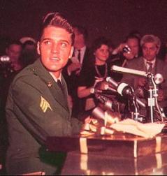 Elvis Presley in army uniform at a press conference
