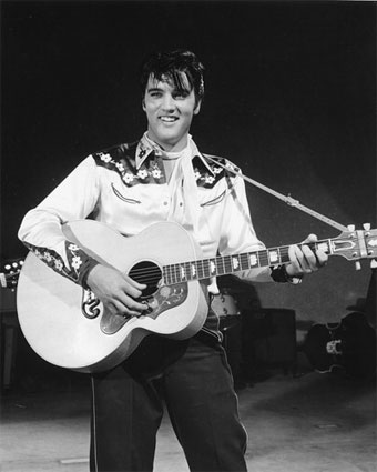 Elvis Presley in cowboy outfit
