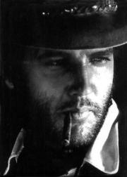 Elvis Presley in cowboy outfit_smooking cigar
