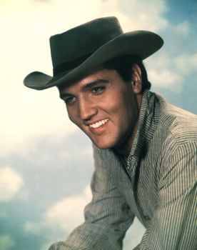 Elvis Presley in cowboy outfit_wearing hat
