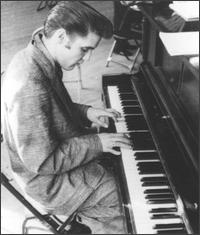 Elvis Presley playing pinano_black and white picture
