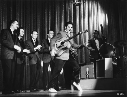 Elvis Presley singing and dancing
