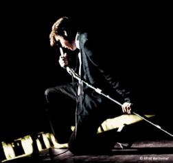 Elvis Presley singing in passion