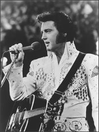 Elvis Presley singing white fansy outfit
