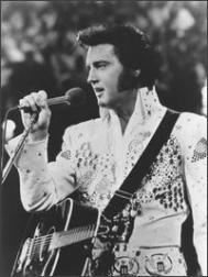 Elvis Presley singing white fansy outfit