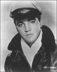 Elvis Presley wearing a pilot outfit
