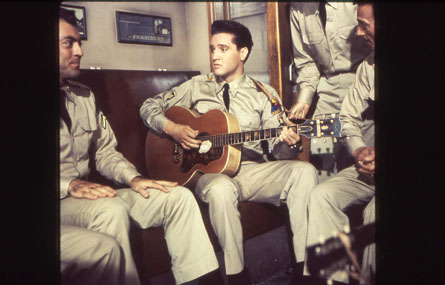 Elvis Presley wearing army uniform
