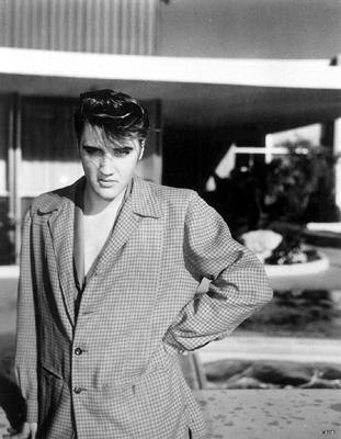 Elvis wearing a big suitecoat
