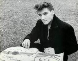 Elvis with a paper guitar
