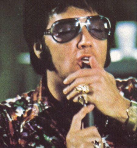 Elvis with his big black sunglasses
